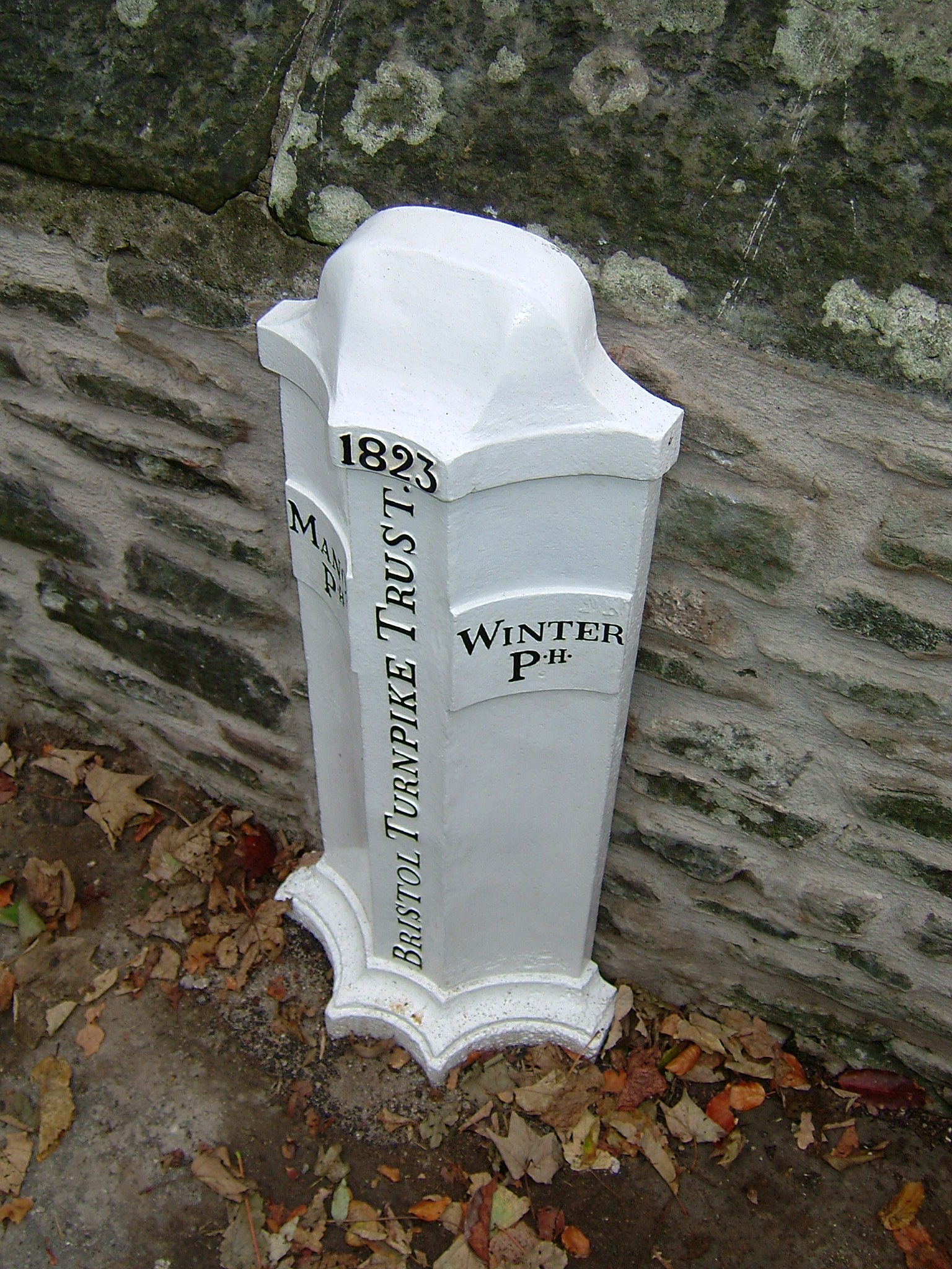 Photograph of the White Bristol Turnpike trust marker post on Cleeve Bridge. 