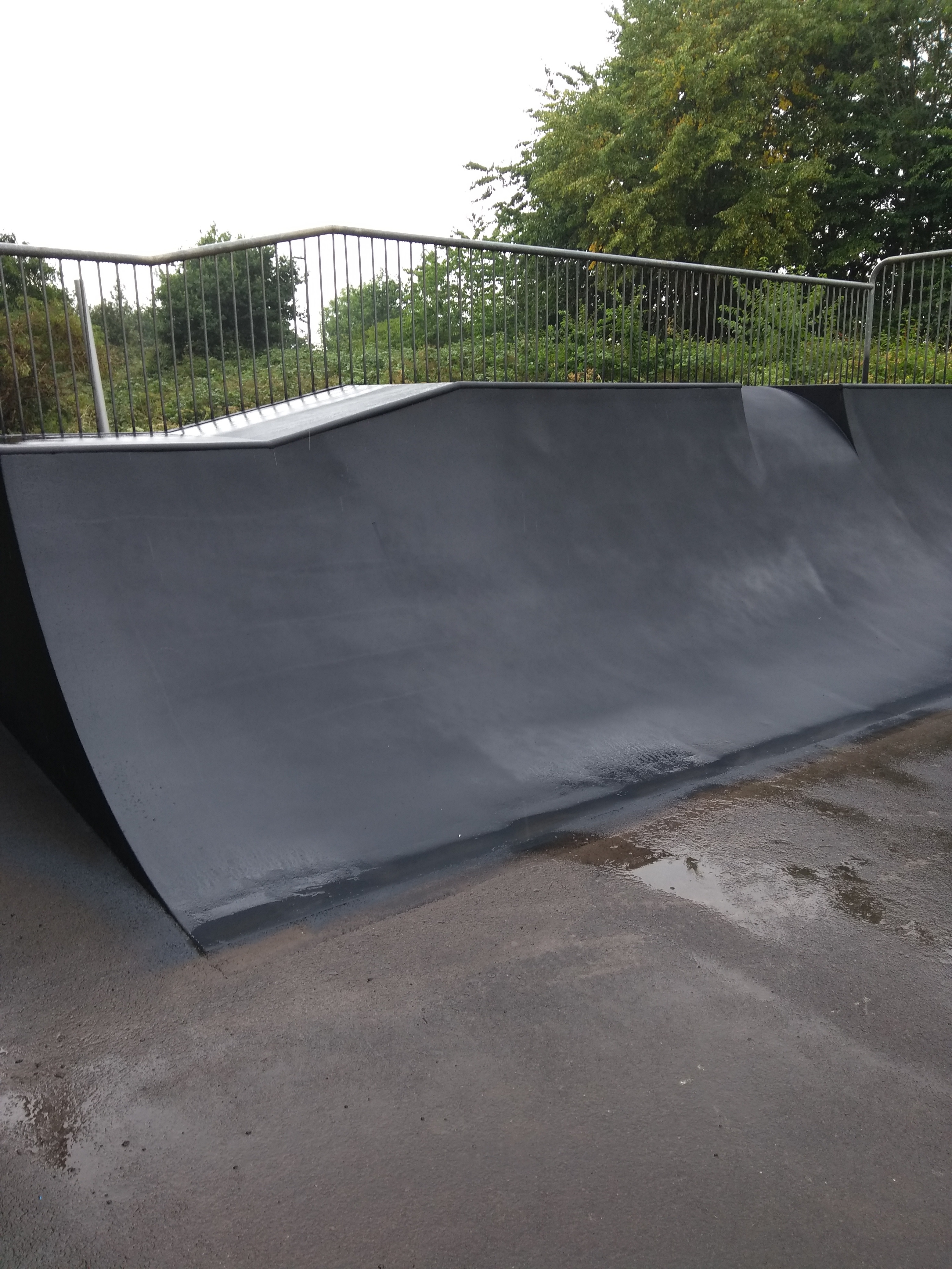 the view of the roll-in and Quarterpipes at the other end of the skate park